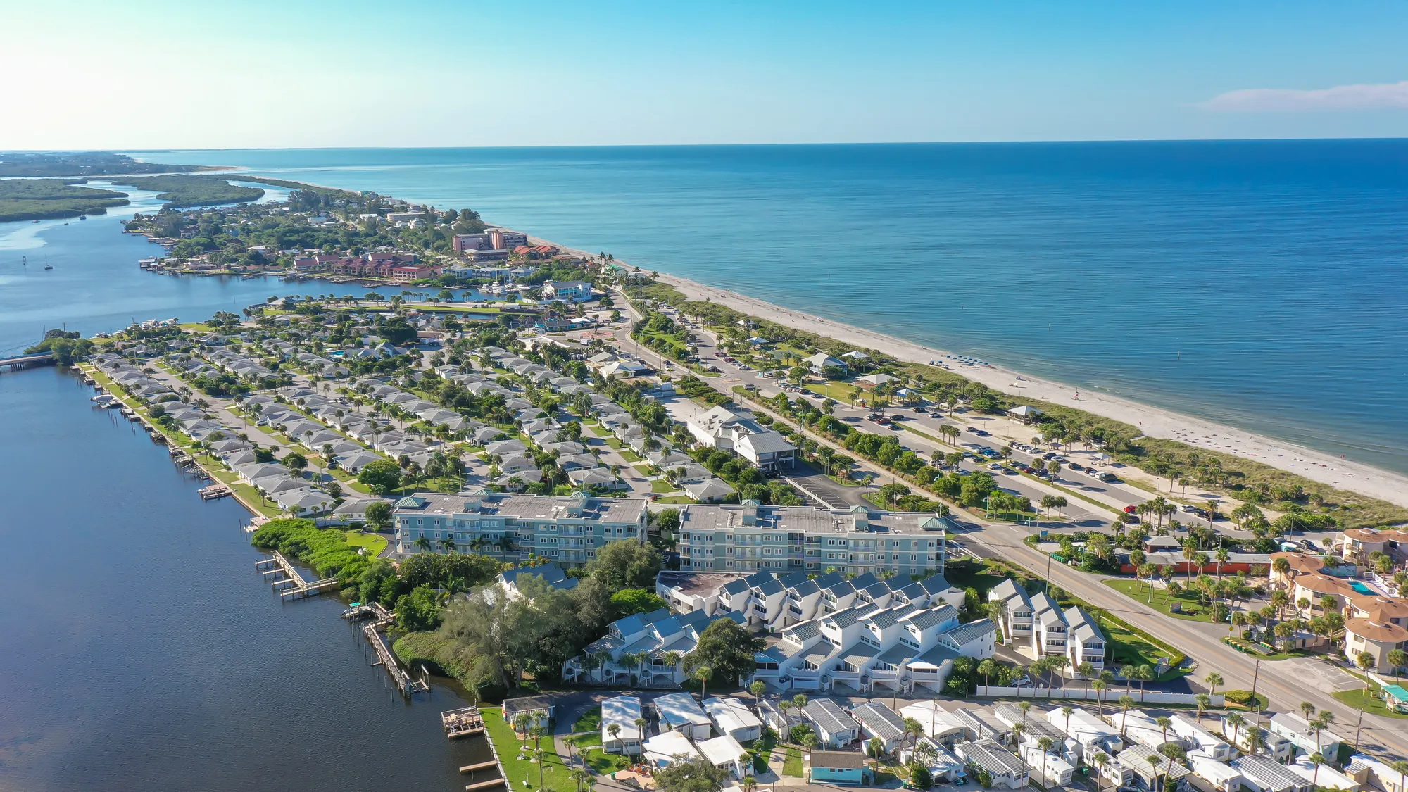 Aerial along the coastline showing Live Oak Landings, the beach and the Gulf of Mexico.