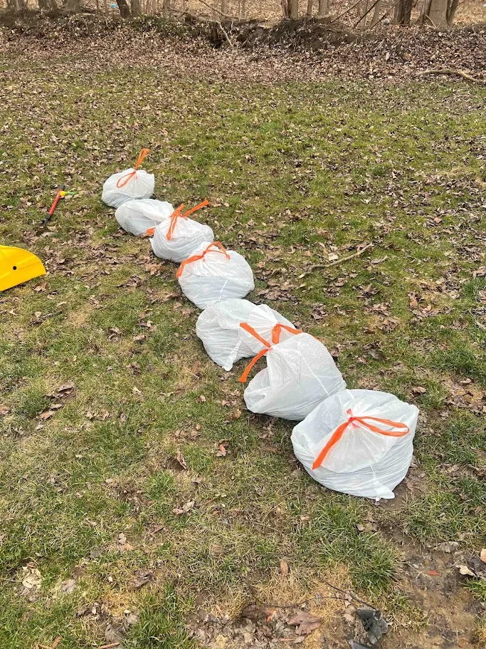 Bagged yard waste from spring cleanup ready for removal
