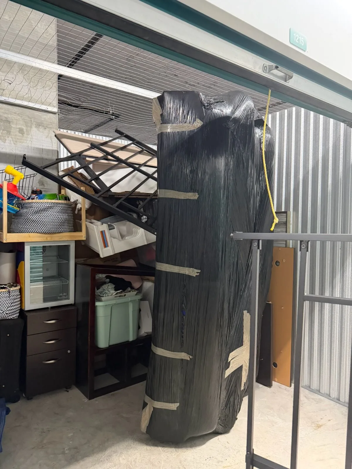 The same storage unit emptied down to the bare floor