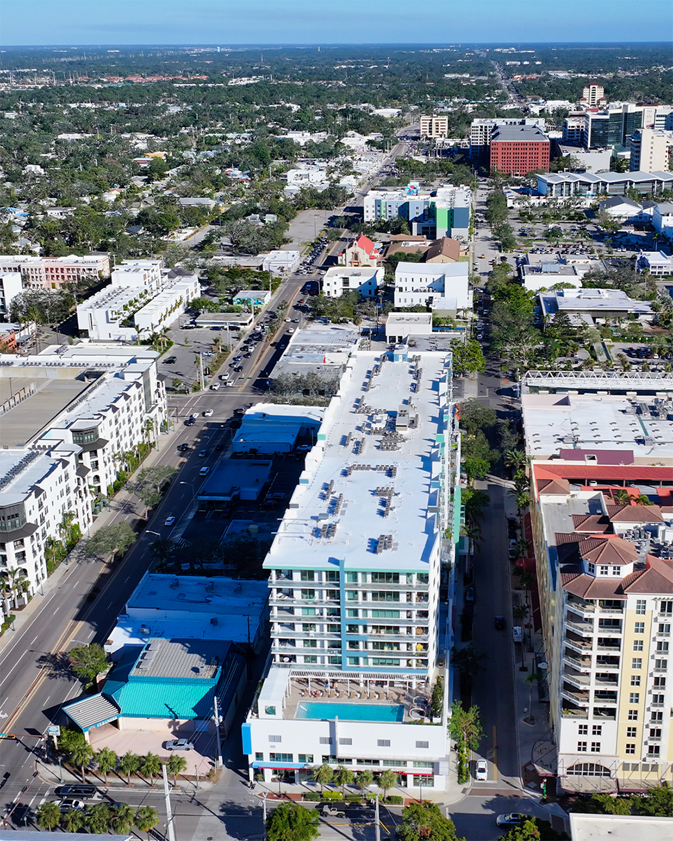 Street-level view of Waterview Echelon City Center, a multi-storey mixed-use building with ground-floor retail.
