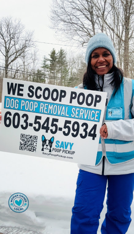 Savy Poop Pickup sign held up on a snowy New Hampshire day