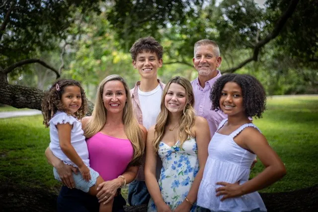 The Clark family posing outdoors together