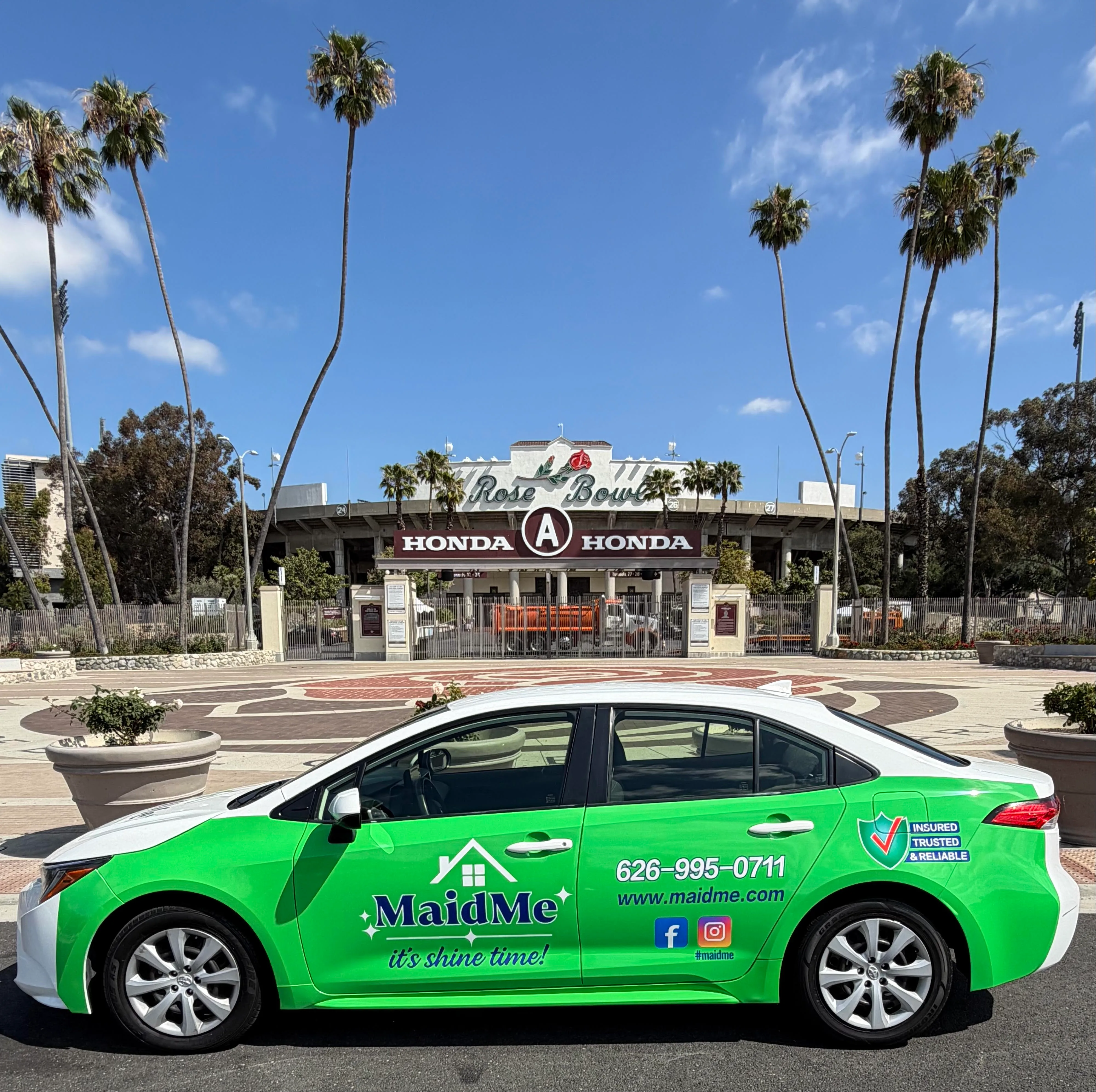 MaidMe branded vehicle parked in front of the Rose Bowl in Pasadena