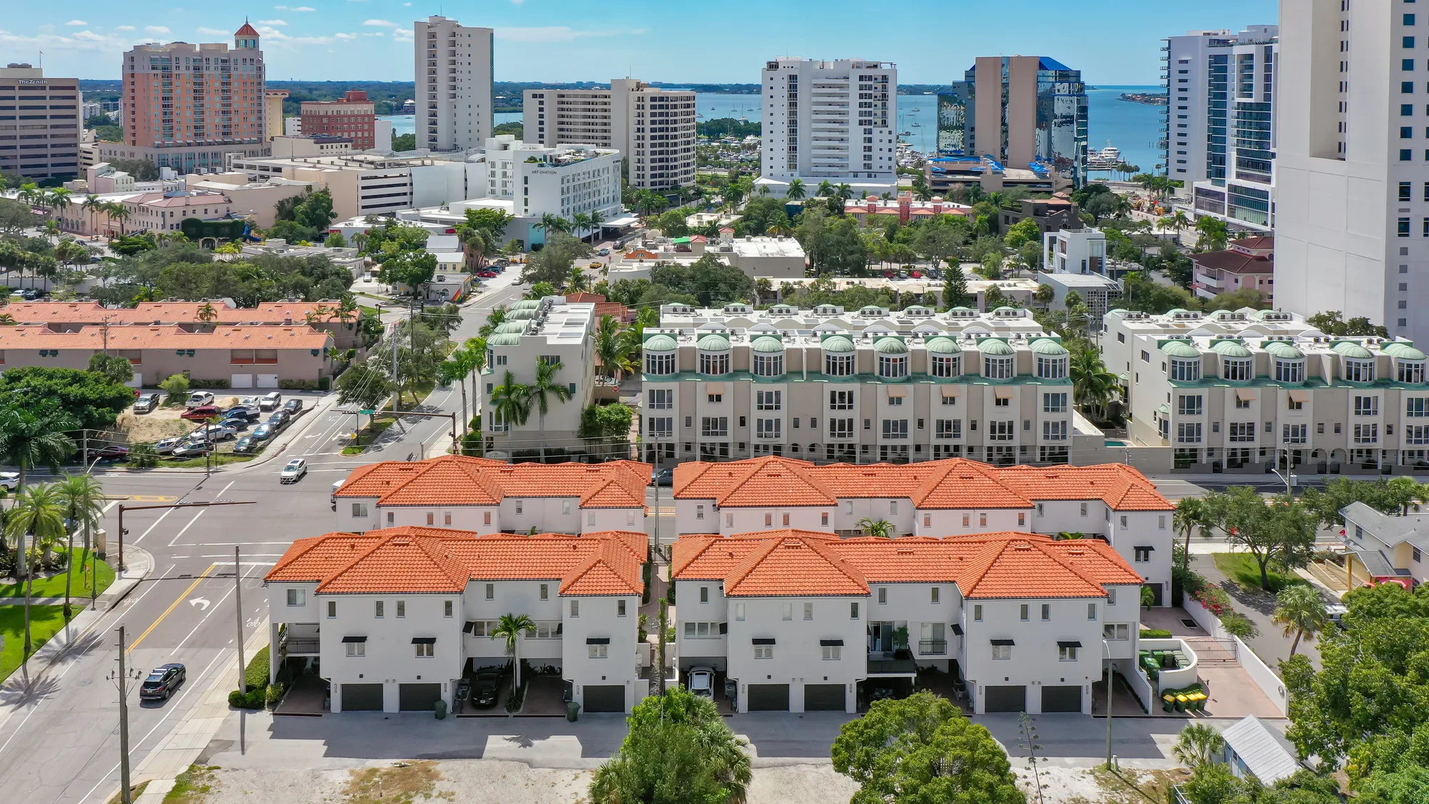 Aerial of The Encore townhomes with the Sarasota skyline behind them.