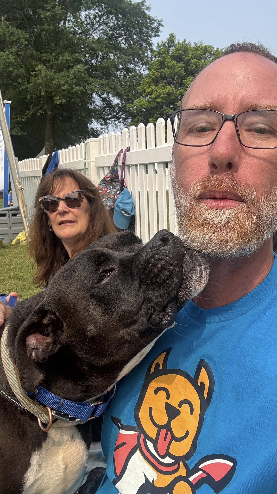 Scoop Rescue team with a happy dog outdoors