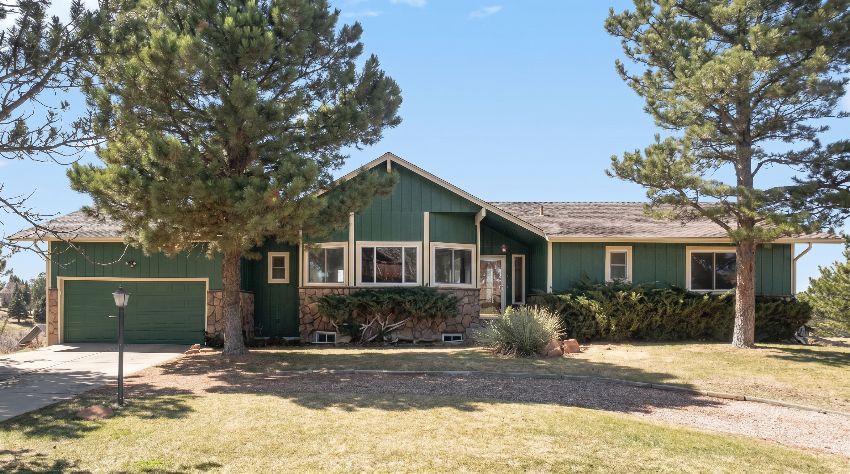 Green family home with stone facade