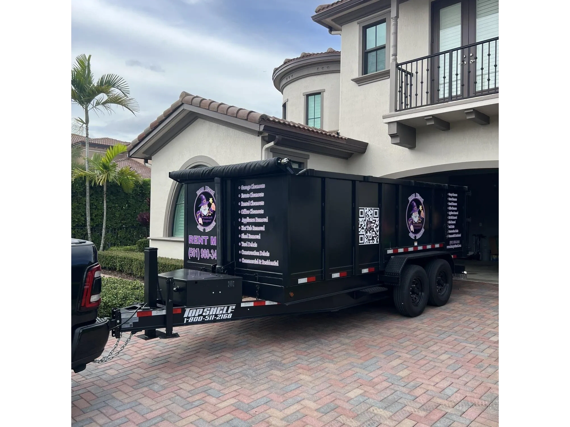 Dump Wizard trailer staged at an upscale South Florida home
