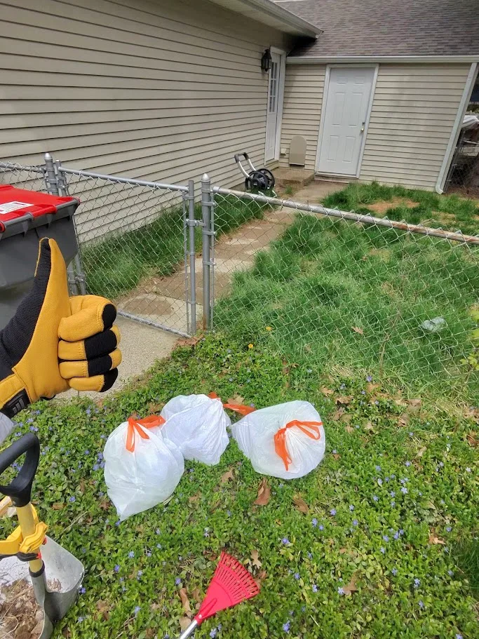 Dog Doody Patrol technician cleaning a yard