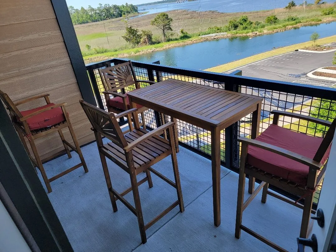 Wooden balcony with outdoor seating — typical coastal Southport property