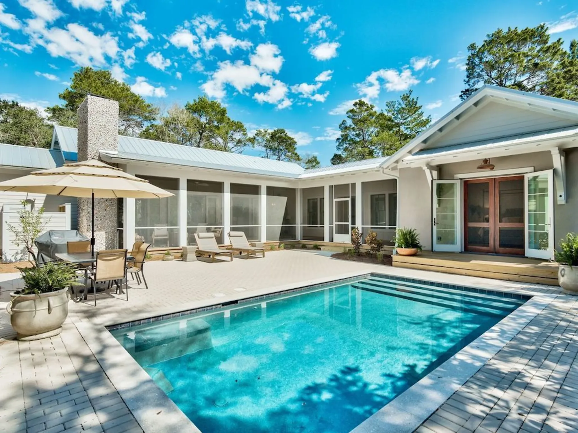 A finished JAT Specialties home with a pool courtyard and screened porch.