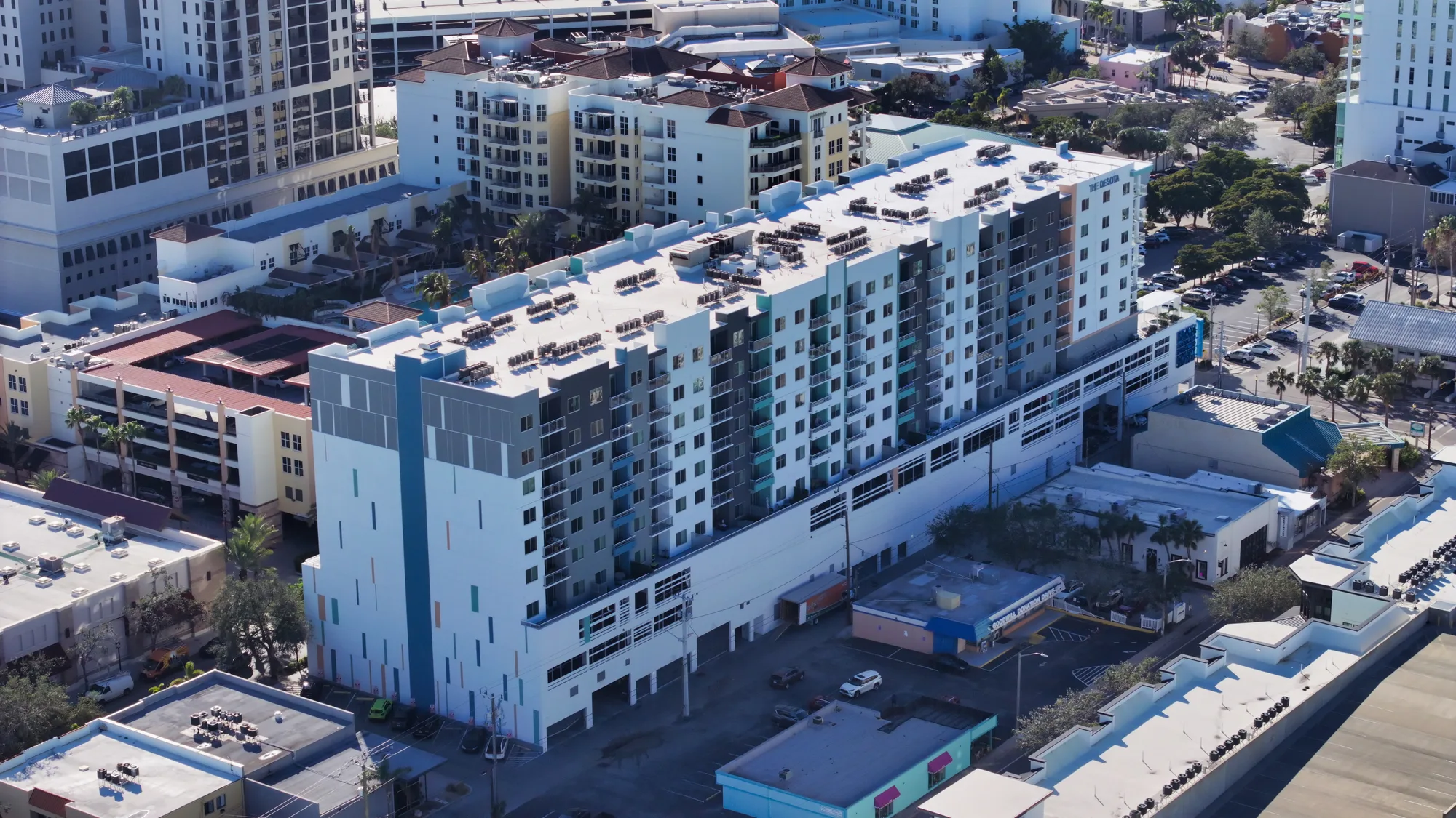 Aerial of The Desota Apartments showing the rooftop and the surrounding downtown Sarasota blocks.