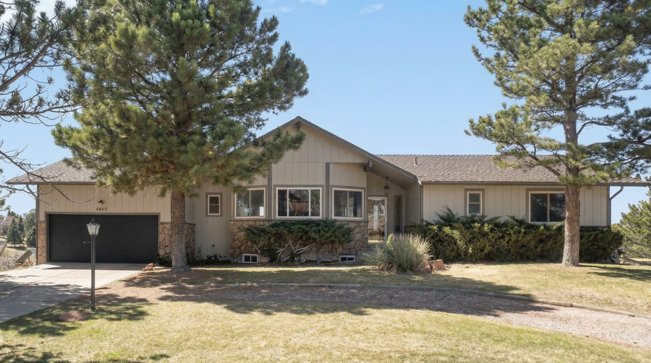 Single-story home with wood and stone exterior