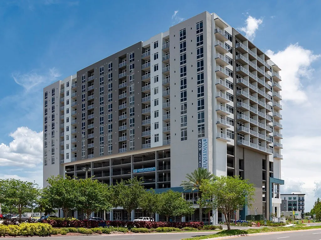 Street-level view of Waterview Echelon City Center, a multi-storey mixed-use building with ground-floor retail.