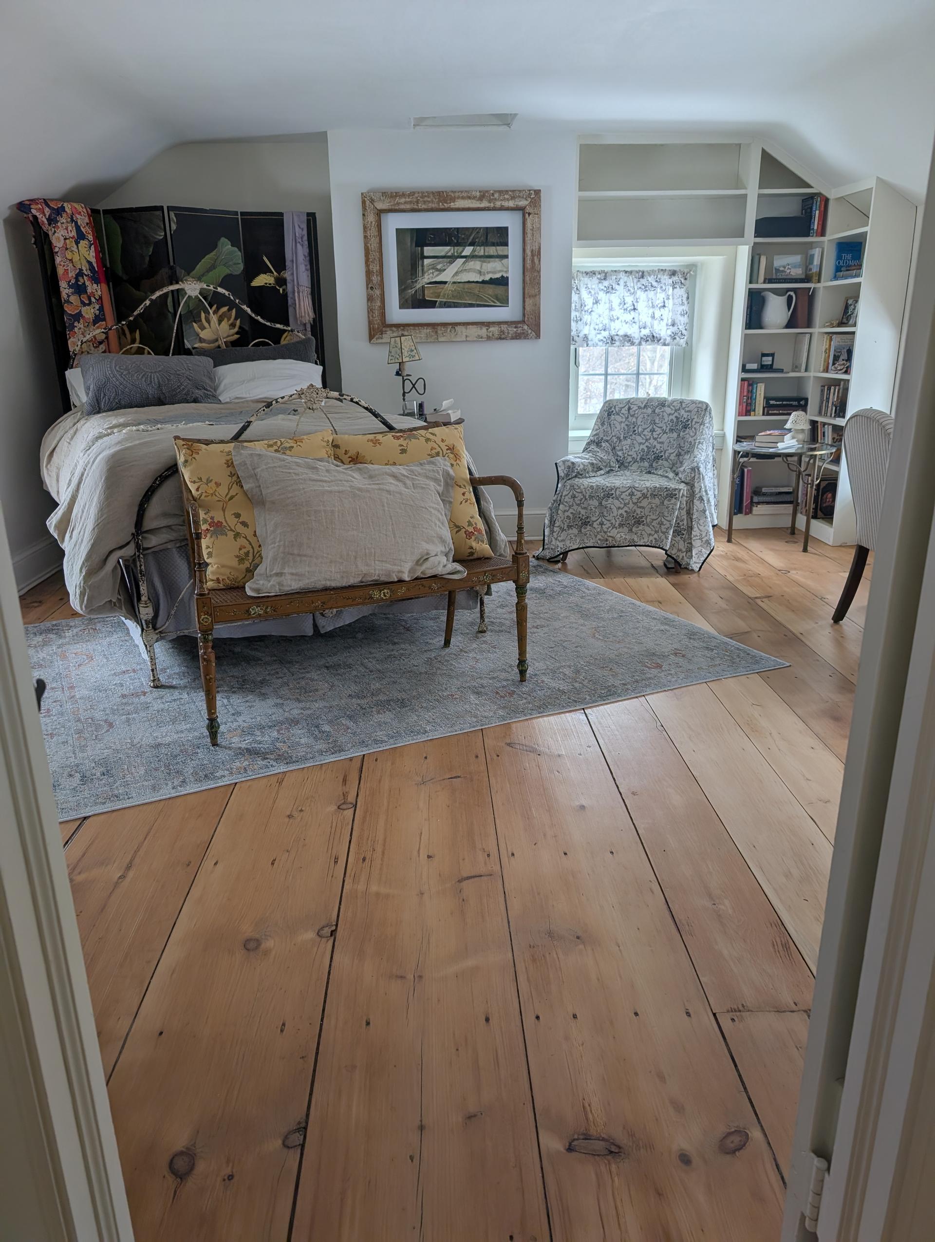 Bedroom with precision flooring installation and natural light