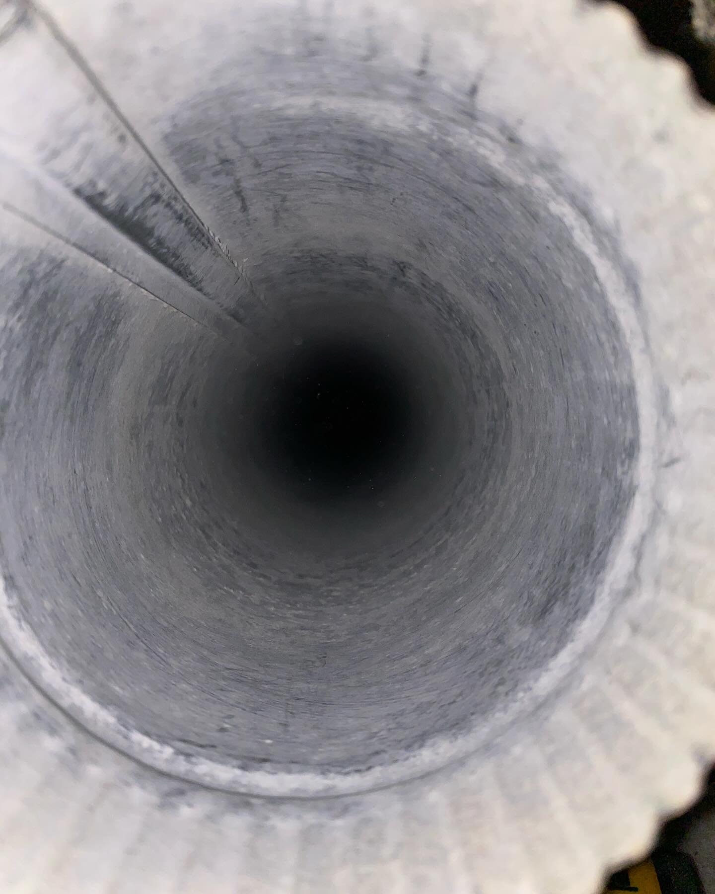 Clean interior of a vertical pipe after dryer vent cleaning