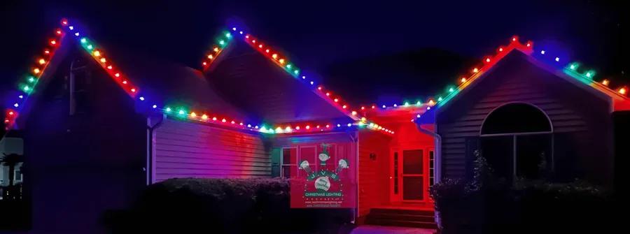 Home lit in multi-colored Christmas lights