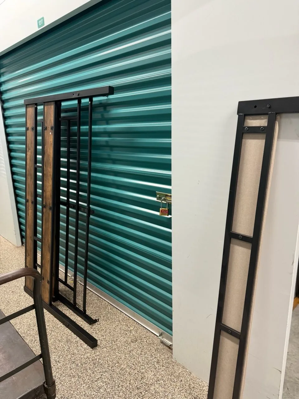 Storage unit stacked full of belongings before the clear-out
