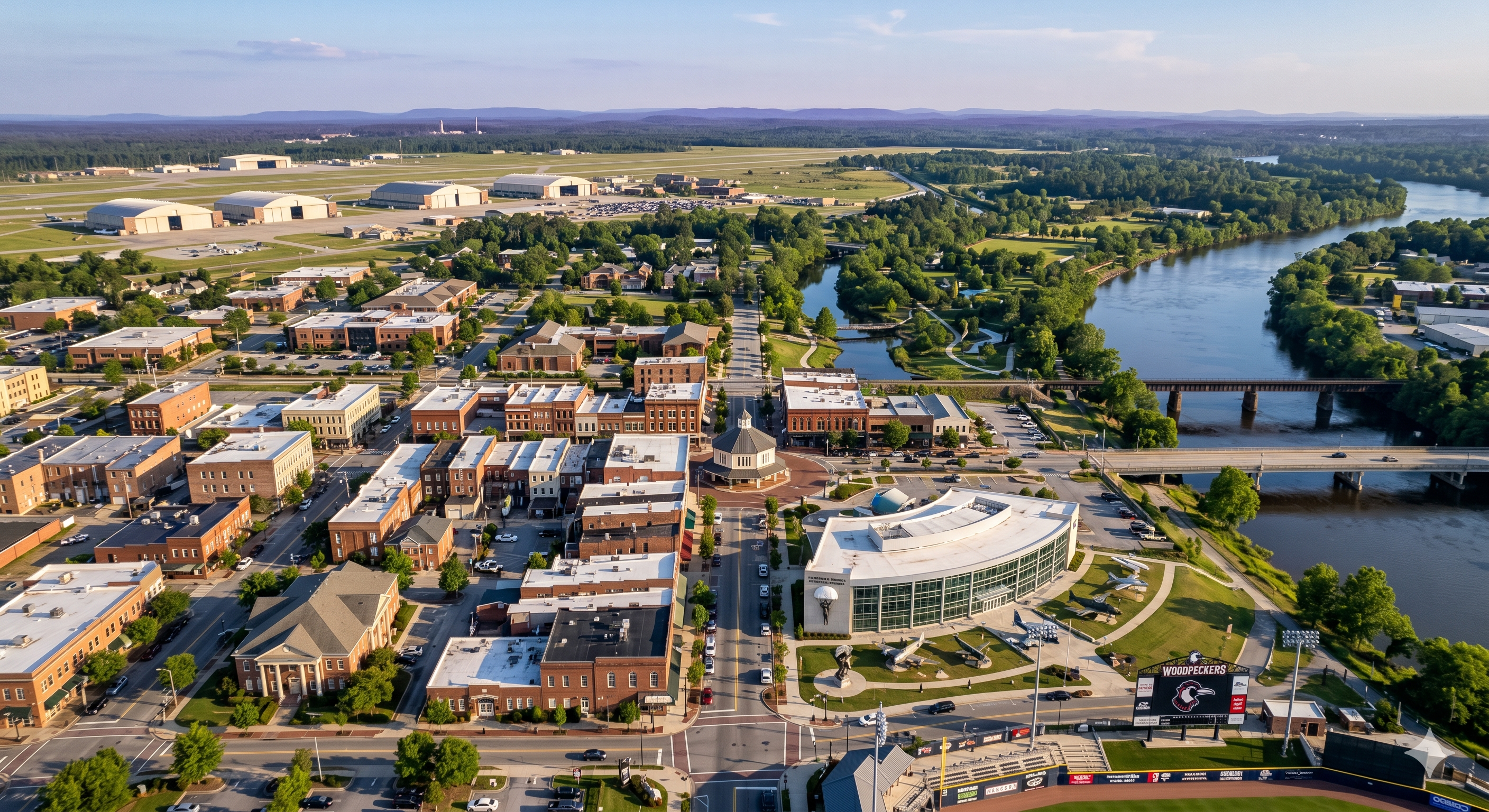 Aerial view of a southeastern NC riverfront town with parks, residential neighborhoods, and mixed-use areas