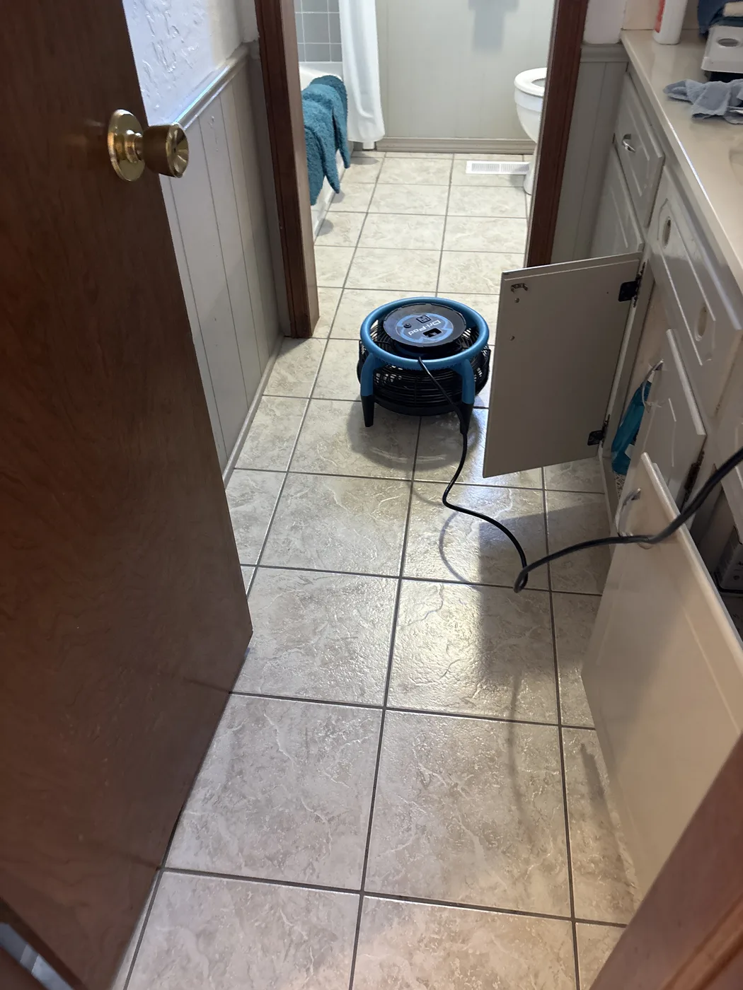 A tiled bathroom floor at an Aqua Steam job.