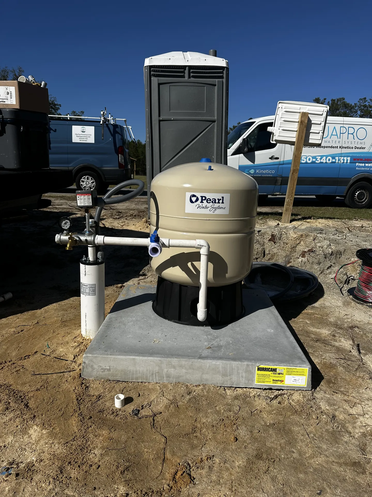 Water system tank on fresh concrete at a construction site