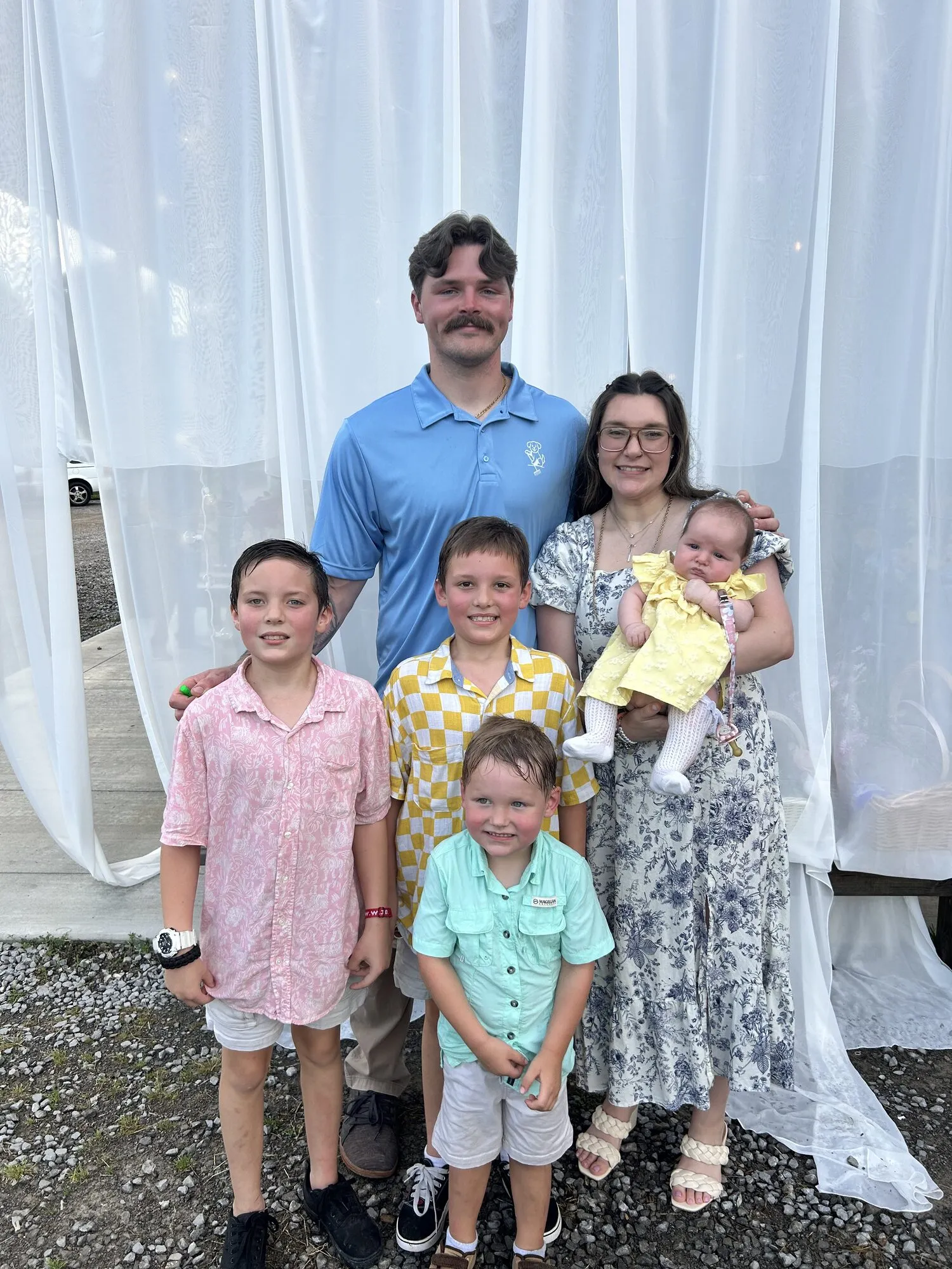 Poop Scoop Dudes owner Dalton Ballenger with his family