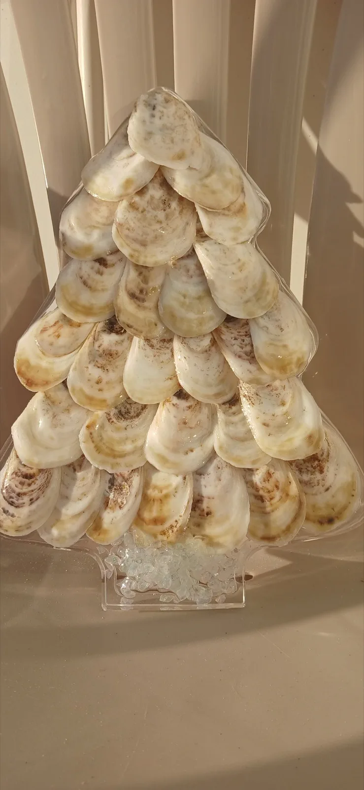 Freestanding Christmas tree made from overlapping natural oyster shells
