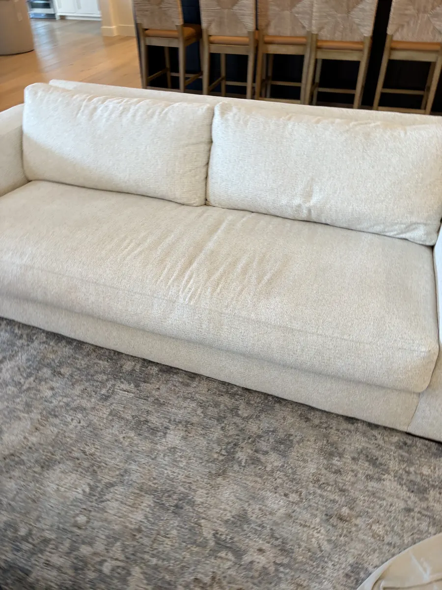 Cream upholstered sofa photographed by Aqua Steam