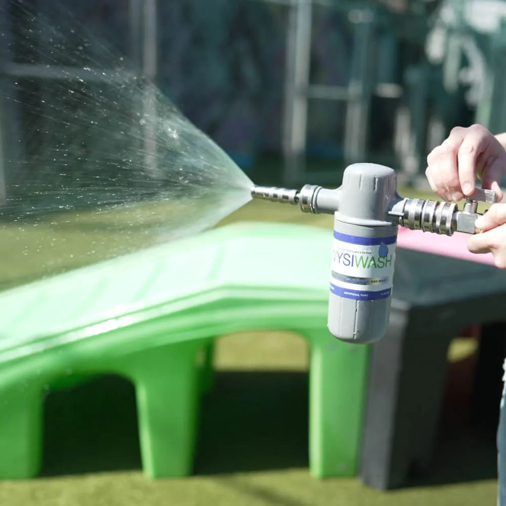 A hose-end sprayer applying pet-safe yard sanitizer
